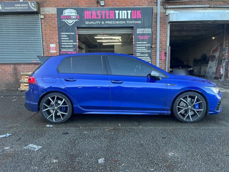 Blue VW Golf R with tinted rear windows outside Mastertint UK, Bolton